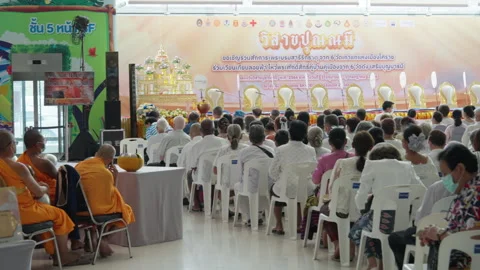 Thai Monks, Crowd Sit &amp; Wait For Indoor Buddhist Vesak Ceremony To Start Stock Footage 247578230