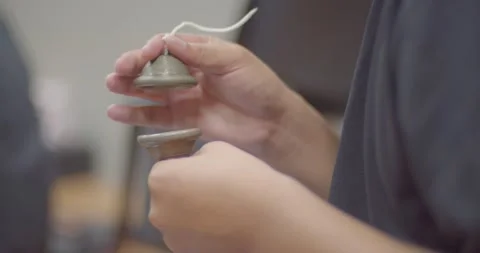 Thai musical instruments.Small cup-shaped cymbals provide a consistent rhythm Stock Footage 222947322