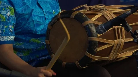 Thai musician knocks on the drum, sets the rhythm of the fight for boxers. Stock Footage 119407224