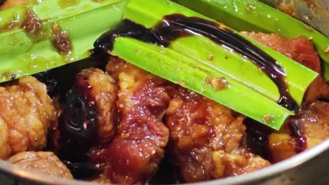 Thai Pandan Chicken or Kai Ho Bai Toei drizzled with sweet dark soy sauce. Stock Footage 344557677