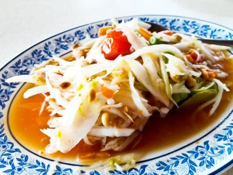 Thai papaya salad also known as Som Tum from Thailand. Stock Photos