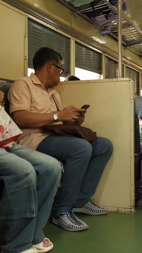 Thai Passengers Commuting on a Local Train in Bangkok Thailand Video stock 327711044