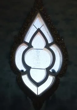 Thai pattern on glass for a background image. Stock Photos