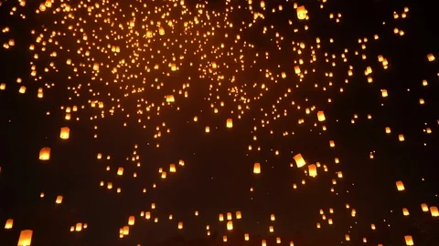 Thai people release sky floating lanterns or lamp to worship Buddha's relics  Video stock 121858319