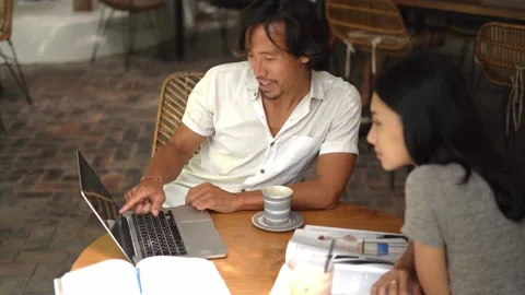 Thai persons team working computer cafe. Employees discussion cowork conference. Stock Footage 235761217