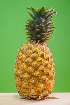 Thai pineapple close-up on a green background Foto stock
