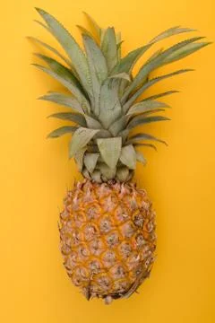 Thai pineapple on a yellow background Stock Photos