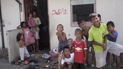 Thai poor group of friendly children in front of house happy smiley curious Stock Footage 157447550