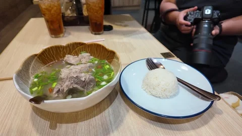 Thai Pork Rib Soup and Steamed Rice on Restaurant Table Stock Footage 344089508