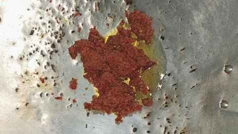 Thai Red Curry Paste Sauting in a Wok Stock Photos