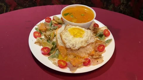 Thai red curry platter served with rice, omelette, and curry in India. Stock Footage 313715356