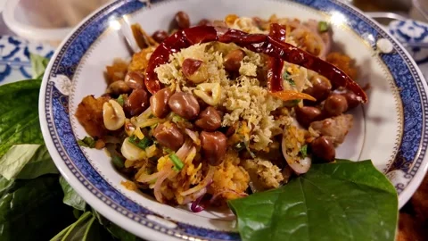 Thai Seafood Dish with Shrimp, Peanuts and Dried Chili Stock-Footage 342945610