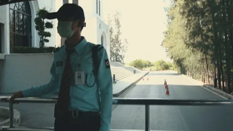 Thai security guard standing at the back of the bus 스톡 동영상 98600181