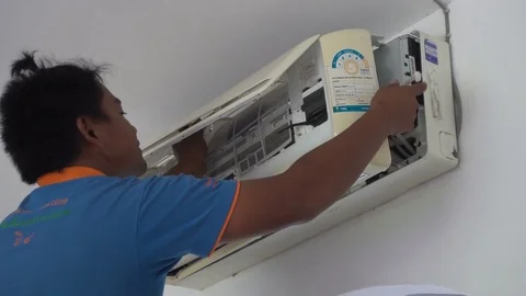 Thai Service Man Fixing Air Conditioner, Thailand - 15 September 2017 Stock Footage 80796819