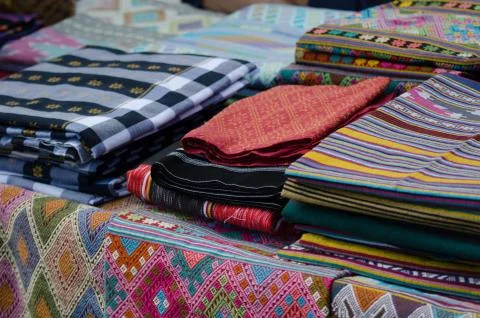 Thai silk is woven using ancient methods of weaving. No machinery Is the trad Stock Photos