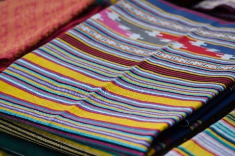 Thai silk is woven using ancient methods of weaving. No machinery Is the trad Stock Photos