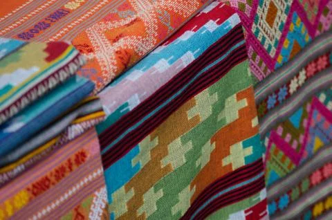 Thai silk is woven using ancient methods of weaving. No machinery Is the trad Stock Photos