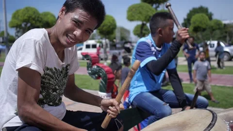 Thai smiley joy drummers at Chak Phra traditional Buddhist boat festival Slowmo Stock Footage 156748832