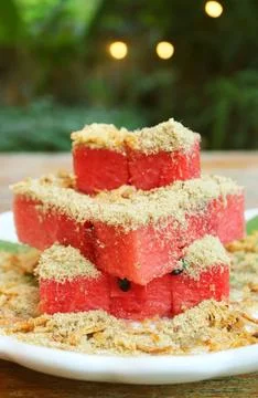 Thai Snack Called Tangmo Pla Haeng, Juicy cubes of watermelon and dried fish Stock Photos