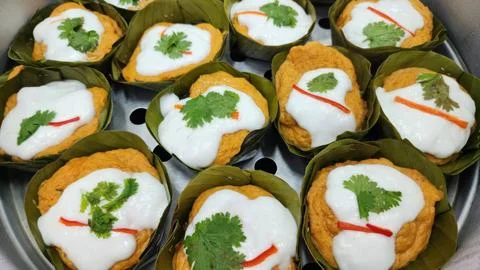Thai steamed fish with curry paste Stock Photos