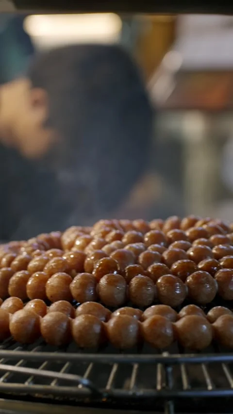 Thai Street Food: Steaming Tiny round Sausages Stock Footage 314704420