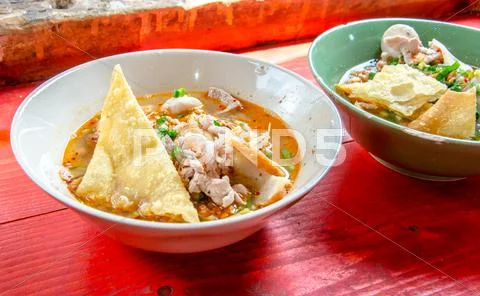 Thai street food traditional tom yum noodle soup with pork Stock Photos