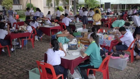 Thai students making design cactus succulent terrarium with color sand art Stock Footage 156753103