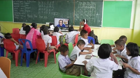 Thai students study English language in classroom listening teacher online Stock Footage 156761986
