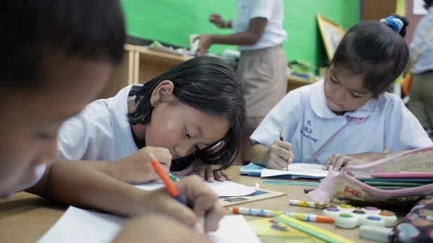 Thai students in uniform study art activity in classroom enjoying their drawing Stock Footage 156858393
