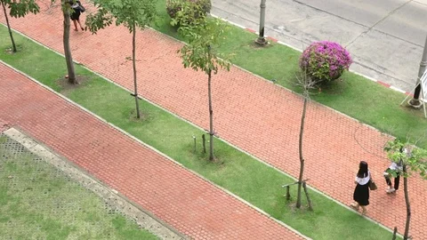 Thai students walking on sidewalk Video stock 98601330