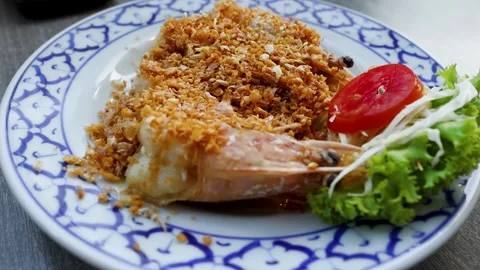 Thai Style Fried Shrimp with Crispy Garlic on Blue Patterned Plate Stock Footage 333305939