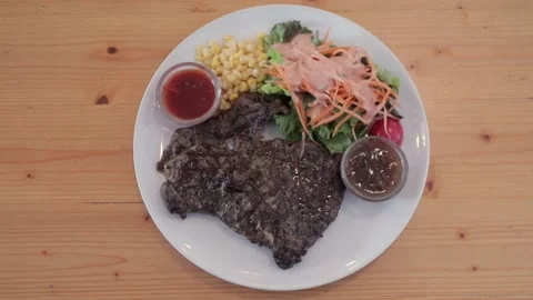 Thai Style Grass Fed Beef Steak Grilled Ribeye, Vegetable Salad, Corn and Sauce Видео 229600441
