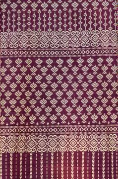 Thai style pattern fabric close up background. Stock Photos