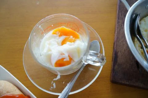 Thai Style Soft Boiled Eggs Served in a Clear Glass Cup for Breakfast 库存照片