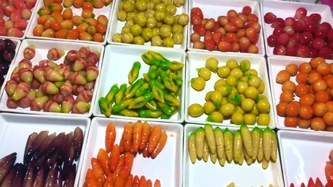 Thai sweets cooked in the form of multi-colored small vegetables Stock Footage 108694631
