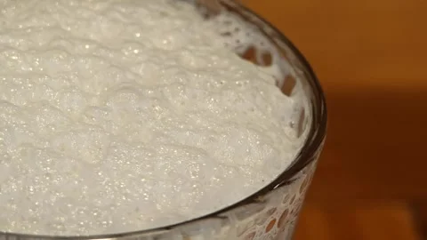 Thai tea drink with a foam in a cup Video stock 304437190
