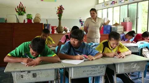 Thai Teacher Checking On Her Students During Test 스톡 동영상 34547067