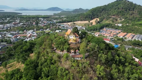 Thai temple on a hill overlooking the sea bay. Drone video Stock Footage 300099062