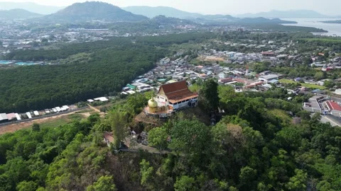Thai temple on a hill overlooking the sea bay. Drone video Stock Footage 300099196