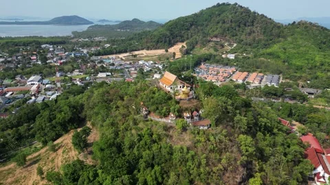 Thai temple on a hill overlooking the sea bay. Drone video Stock Footage 300099641