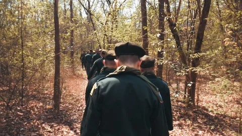 Thai Territorial Defense Students walking through a forest at Khao Chon Kai  Stock Footage 100640281