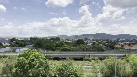 Thai Town Elevated Railway Mountains  Dramatic Clouds Hua Hin Thailand 4K Stock Footage 335698100
