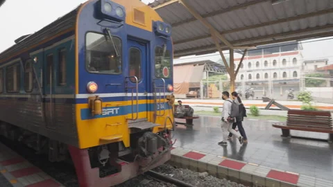 Thai train passengers are getting on the train at train station in Chiang Mai Stock Footage 240369537