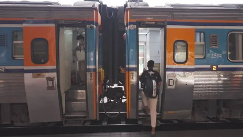 Thai train passengers are getting on the train at train station in Chiang Mai Stock Footage 240369549