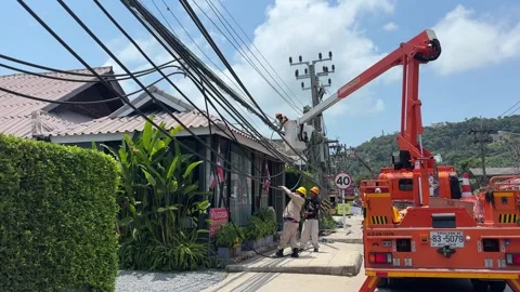 Thai Utility Workers Maintain Overhead Power Lines 스톡 동영상 331513115