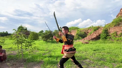 Thai Warrior Practicing Ancient Sword Fighting at Ayutthaya Historical Park Stock Footage 343807431