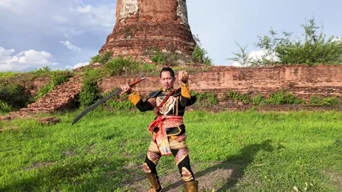 Thai Warrior Practicing Ancient Sword Fighting at Ayutthaya Temple Ruins Stock Footage 344725194