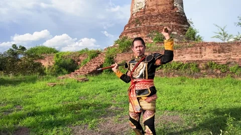 Thai Warrior Practicing Sword Skills at Ancient Ayutthaya Temple Ruins Stock Footage 343807573