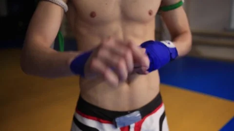 Thai warrior winds up handwraps Stock Footage 71624453