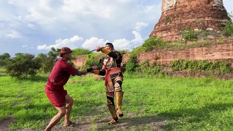 Thai Warriors Sword Fighting Reenactment at Ancient Ayutthaya Ruins Stock Footage 346018408